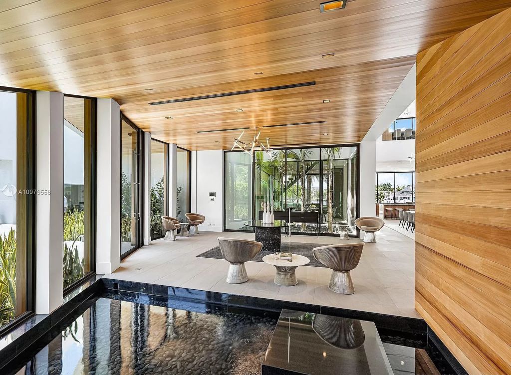 The Boca Raton Mansion is a spectacular contemporary residence on an oversized Intracoastal Waterway lot now available for sale. This home located at 819 Orchid Dr, Boca Raton, Florida; offering 9 bedrooms and 14 bathrooms with over 12,600 square feet of living spaces.