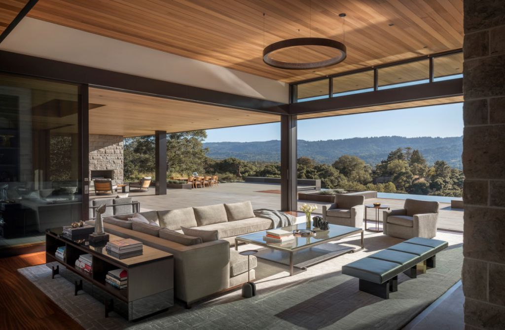 Portola Valley House in California was designed by SB Architects in Modern style to create an intimate space and a single-story home to age in place; this house offers views of the rolling hills overlooking the valley in several directions, creating an idyllic escape.