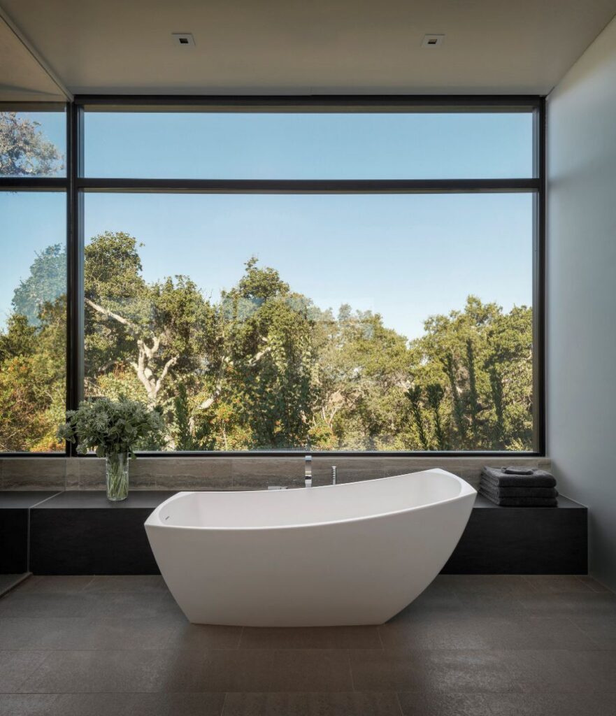 Portola Valley House in California was designed by SB Architects in Modern style to create an intimate space and a single-story home to age in place; this house offers views of the rolling hills overlooking the valley in several directions, creating an idyllic escape.