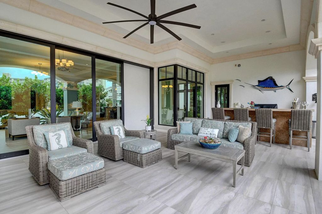 The Boca Raton House is an incredible Intracoastal estate features Resort style living with pool, outdoor kitchen and bar now available for sale. This home located at 7596 NE Orchid Bay Ter, Boca Raton, Florida; offering 5 bedrooms and 7 bathrooms with over 8,000 square feet of living spaces.