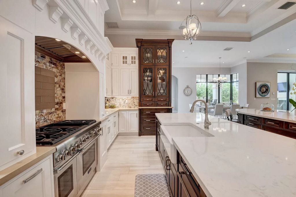 The Boca Raton House is an incredible Intracoastal estate features Resort style living with pool, outdoor kitchen and bar now available for sale. This home located at 7596 NE Orchid Bay Ter, Boca Raton, Florida; offering 5 bedrooms and 7 bathrooms with over 8,000 square feet of living spaces.
