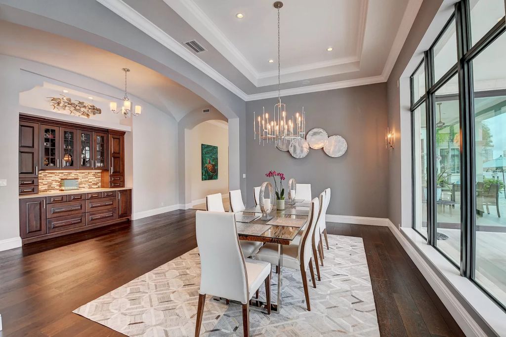 The Boca Raton House is an incredible Intracoastal estate features Resort style living with pool, outdoor kitchen and bar now available for sale. This home located at 7596 NE Orchid Bay Ter, Boca Raton, Florida; offering 5 bedrooms and 7 bathrooms with over 8,000 square feet of living spaces.