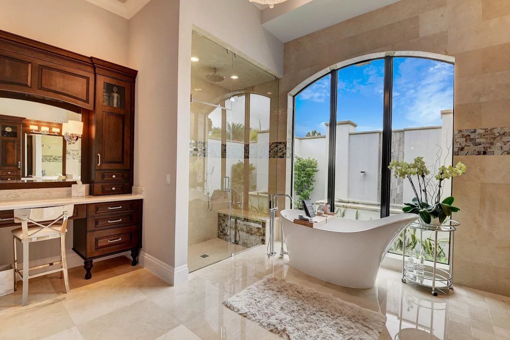 The Boca Raton House is an incredible Intracoastal estate features Resort style living with pool, outdoor kitchen and bar now available for sale. This home located at 7596 NE Orchid Bay Ter, Boca Raton, Florida; offering 5 bedrooms and 7 bathrooms with over 8,000 square feet of living spaces.