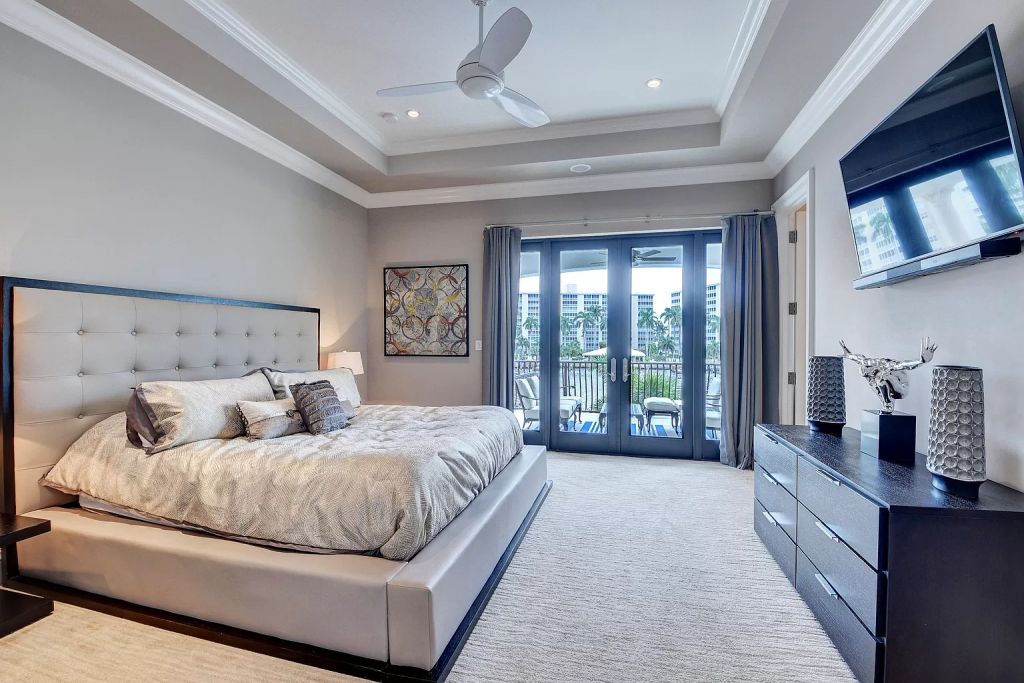 The Boca Raton House is an incredible Intracoastal estate features Resort style living with pool, outdoor kitchen and bar now available for sale. This home located at 7596 NE Orchid Bay Ter, Boca Raton, Florida; offering 5 bedrooms and 7 bathrooms with over 8,000 square feet of living spaces.
