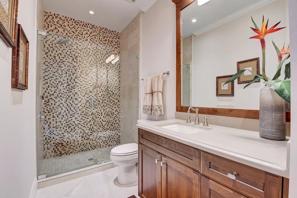 The Boca Raton House is an incredible Intracoastal estate features Resort style living with pool, outdoor kitchen and bar now available for sale. This home located at 7596 NE Orchid Bay Ter, Boca Raton, Florida; offering 5 bedrooms and 7 bathrooms with over 8,000 square feet of living spaces.
