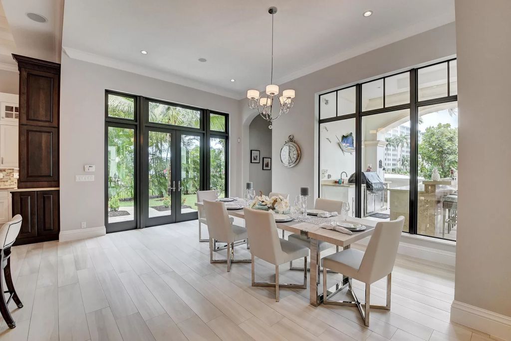 The Boca Raton House is an incredible Intracoastal estate features Resort style living with pool, outdoor kitchen and bar now available for sale. This home located at 7596 NE Orchid Bay Ter, Boca Raton, Florida; offering 5 bedrooms and 7 bathrooms with over 8,000 square feet of living spaces.
