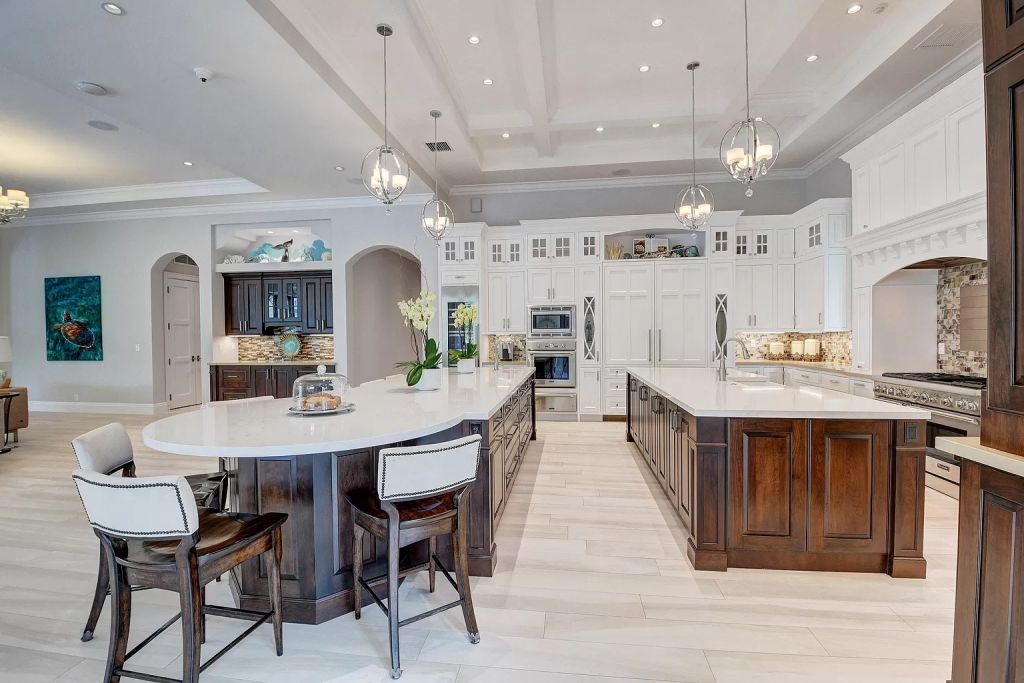 The Boca Raton House is an incredible Intracoastal estate features Resort style living with pool, outdoor kitchen and bar now available for sale. This home located at 7596 NE Orchid Bay Ter, Boca Raton, Florida; offering 5 bedrooms and 7 bathrooms with over 8,000 square feet of living spaces.