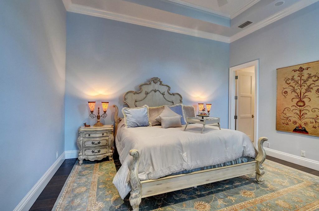 The Boca Raton House is an incredible Intracoastal estate features Resort style living with pool, outdoor kitchen and bar now available for sale. This home located at 7596 NE Orchid Bay Ter, Boca Raton, Florida; offering 5 bedrooms and 7 bathrooms with over 8,000 square feet of living spaces.