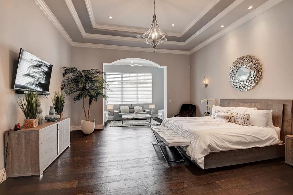 The Boca Raton House is an incredible Intracoastal estate features Resort style living with pool, outdoor kitchen and bar now available for sale. This home located at 7596 NE Orchid Bay Ter, Boca Raton, Florida; offering 5 bedrooms and 7 bathrooms with over 8,000 square feet of living spaces.