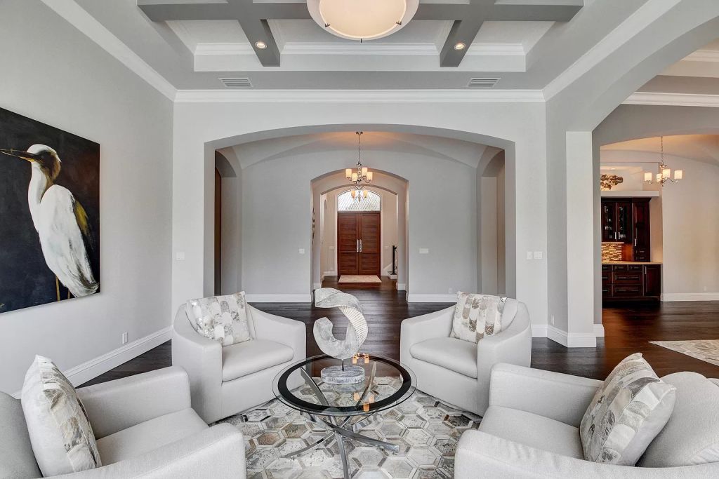 The Boca Raton House is an incredible Intracoastal estate features Resort style living with pool, outdoor kitchen and bar now available for sale. This home located at 7596 NE Orchid Bay Ter, Boca Raton, Florida; offering 5 bedrooms and 7 bathrooms with over 8,000 square feet of living spaces.