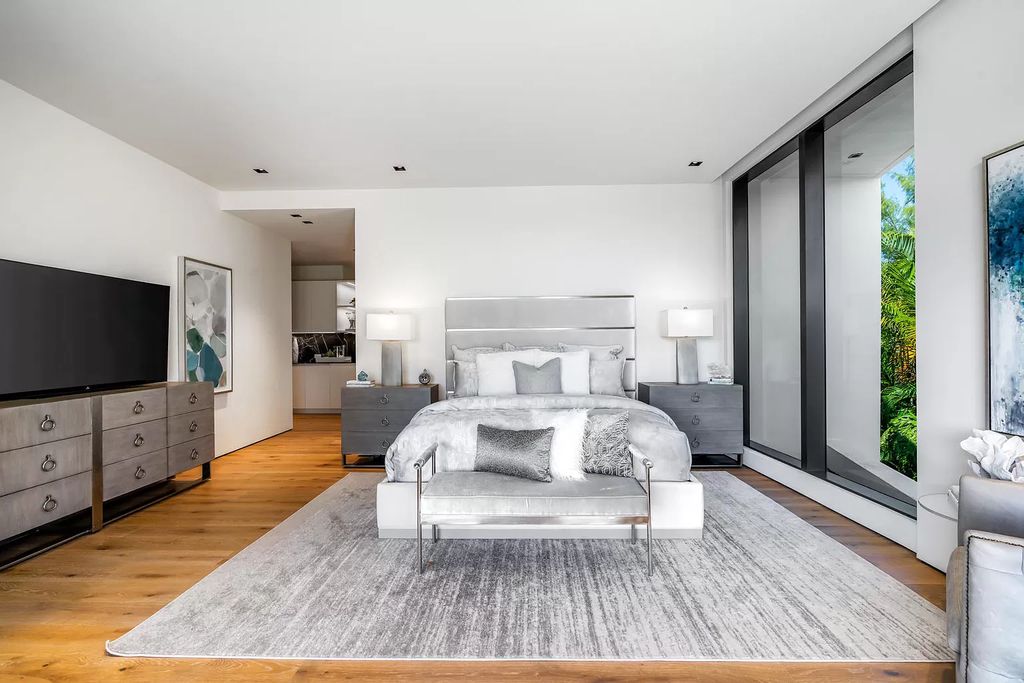 The Boca Raton House is an architectural deepwater estate in The Sanctuary with 3-levels of luxury and style now available for sale. This home located at 824 Pelican Point Cv, Boca Raton, Florida; offering 7 bedrooms and 10 bathrooms with over 7,300 square feet of living spaces.