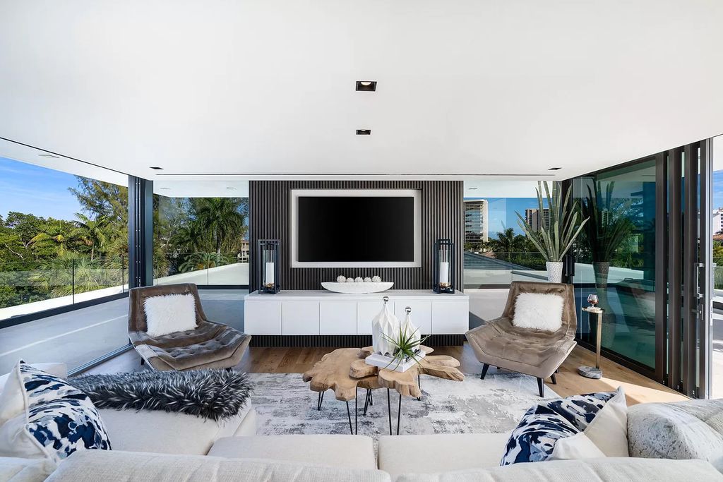 The Boca Raton House is an architectural deepwater estate in The Sanctuary with 3-levels of luxury and style now available for sale. This home located at 824 Pelican Point Cv, Boca Raton, Florida; offering 7 bedrooms and 10 bathrooms with over 7,300 square feet of living spaces.