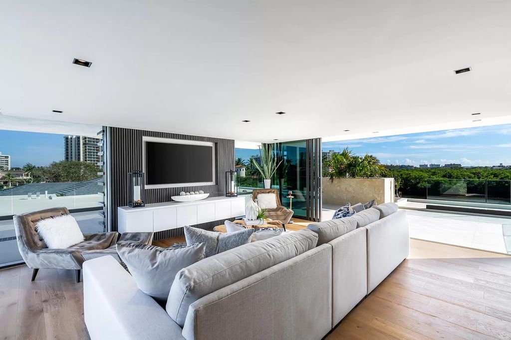 The Boca Raton House is an architectural deepwater estate in The Sanctuary with 3-levels of luxury and style now available for sale. This home located at 824 Pelican Point Cv, Boca Raton, Florida; offering 7 bedrooms and 10 bathrooms with over 7,300 square feet of living spaces.