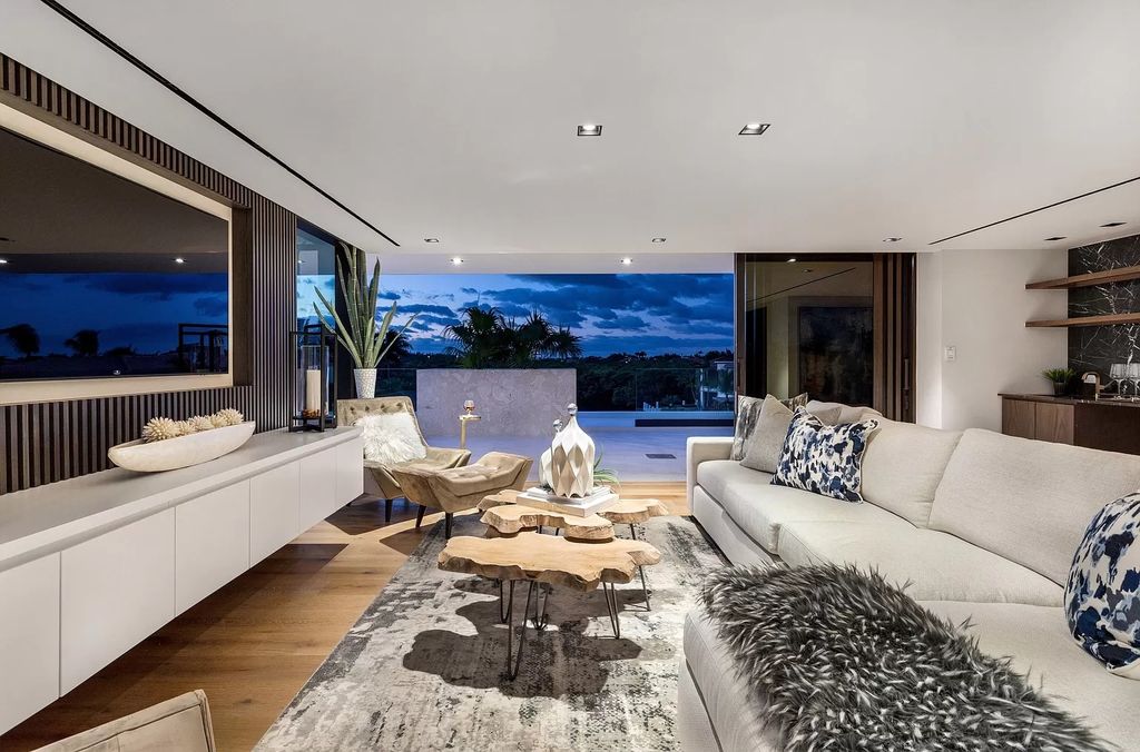 The Boca Raton House is an architectural deepwater estate in The Sanctuary with 3-levels of luxury and style now available for sale. This home located at 824 Pelican Point Cv, Boca Raton, Florida; offering 7 bedrooms and 10 bathrooms with over 7,300 square feet of living spaces.