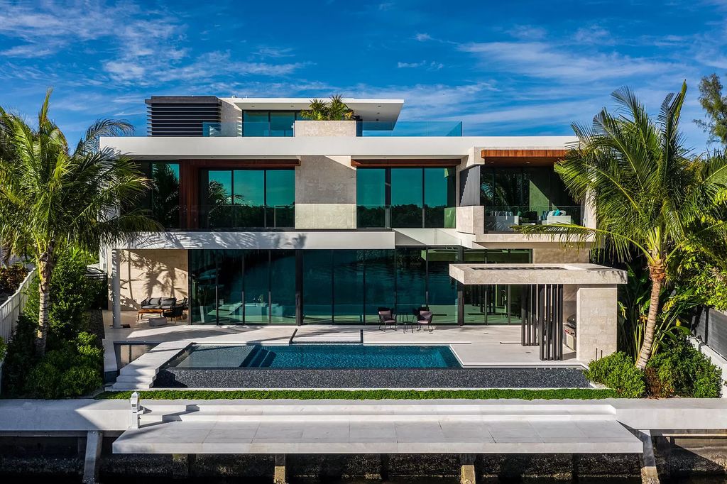 The Boca Raton House is an architectural deepwater estate in The Sanctuary with 3-levels of luxury and style now available for sale. This home located at 824 Pelican Point Cv, Boca Raton, Florida; offering 7 bedrooms and 10 bathrooms with over 7,300 square feet of living spaces.