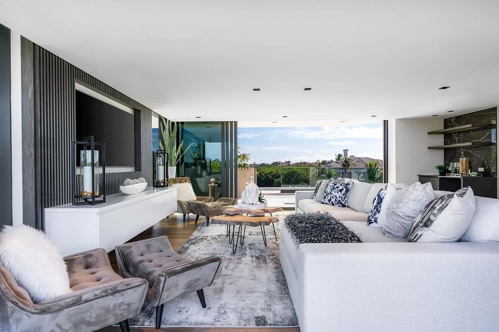 The Boca Raton House is an architectural deepwater estate in The Sanctuary with 3-levels of luxury and style now available for sale. This home located at 824 Pelican Point Cv, Boca Raton, Florida; offering 7 bedrooms and 10 bathrooms with over 7,300 square feet of living spaces.