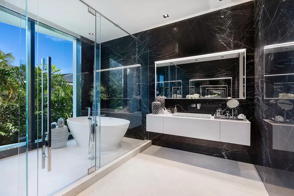 The Boca Raton House is an architectural deepwater estate in The Sanctuary with 3-levels of luxury and style now available for sale. This home located at 824 Pelican Point Cv, Boca Raton, Florida; offering 7 bedrooms and 10 bathrooms with over 7,300 square feet of living spaces.