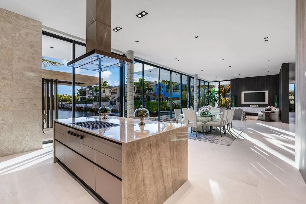 The Boca Raton House is an architectural deepwater estate in The Sanctuary with 3-levels of luxury and style now available for sale. This home located at 824 Pelican Point Cv, Boca Raton, Florida; offering 7 bedrooms and 10 bathrooms with over 7,300 square feet of living spaces.