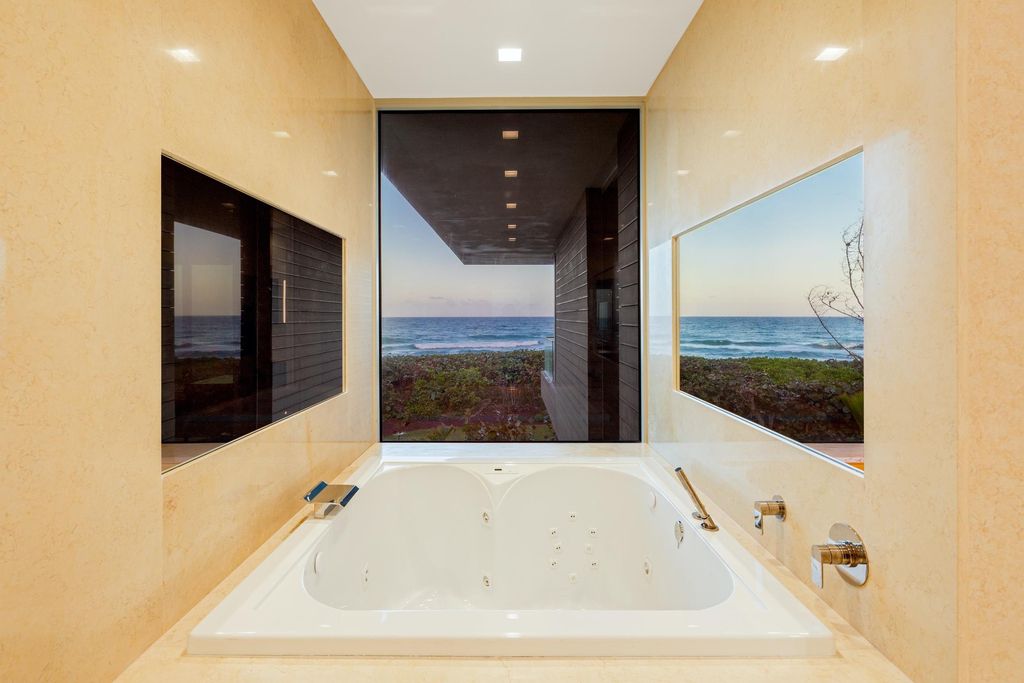 The Modern Mansion in Jupiter Island features spacious living and entertaining spaces with the most panoramic views of the Ocean now available for sale. This home located at 609 S Beach Rd, Jupiter, Florida; offering 6 bedrooms and 9 bathrooms with over 11,700 square feet of living spaces.