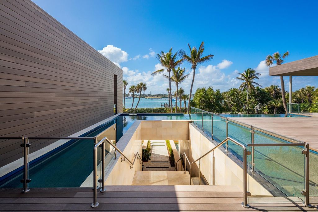 The Modern Mansion in Jupiter Island features spacious living and entertaining spaces with the most panoramic views of the Ocean now available for sale. This home located at 609 S Beach Rd, Jupiter, Florida; offering 6 bedrooms and 9 bathrooms with over 11,700 square feet of living spaces.