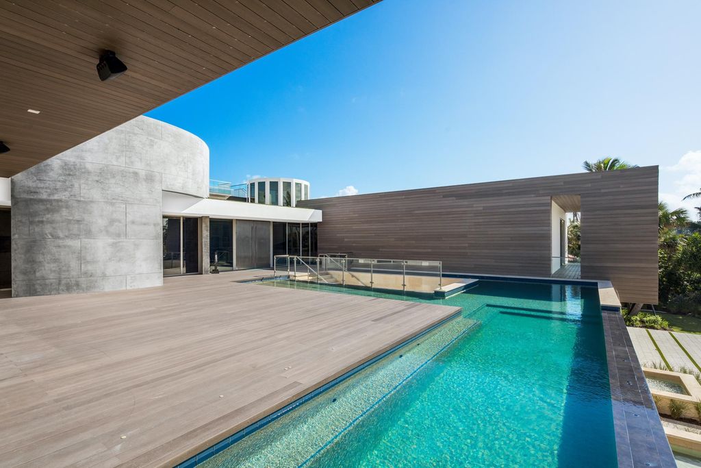 The Modern Mansion in Jupiter Island features spacious living and entertaining spaces with the most panoramic views of the Ocean now available for sale. This home located at 609 S Beach Rd, Jupiter, Florida; offering 6 bedrooms and 9 bathrooms with over 11,700 square feet of living spaces.