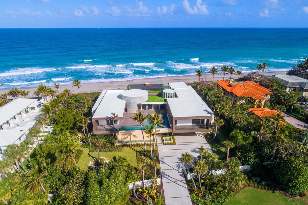 The Modern Mansion in Jupiter Island features spacious living and entertaining spaces with the most panoramic views of the Ocean now available for sale. This home located at 609 S Beach Rd, Jupiter, Florida; offering 6 bedrooms and 9 bathrooms with over 11,700 square feet of living spaces.