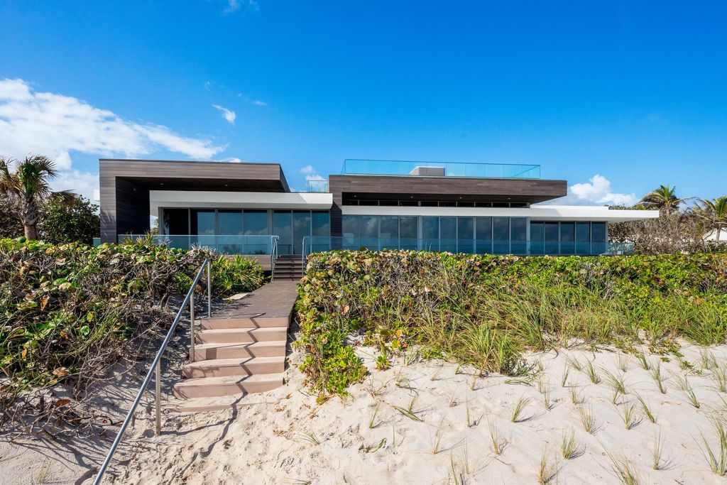 The Modern Mansion in Jupiter Island features spacious living and entertaining spaces with the most panoramic views of the Ocean now available for sale. This home located at 609 S Beach Rd, Jupiter, Florida; offering 6 bedrooms and 9 bathrooms with over 11,700 square feet of living spaces.