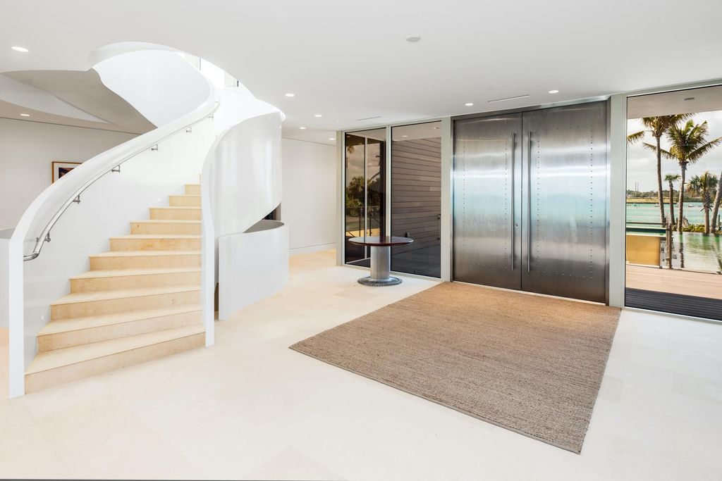 The Modern Mansion in Jupiter Island features spacious living and entertaining spaces with the most panoramic views of the Ocean now available for sale. This home located at 609 S Beach Rd, Jupiter, Florida; offering 6 bedrooms and 9 bathrooms with over 11,700 square feet of living spaces.