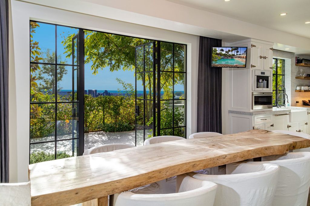 The Modern Farmhouse in Los Angeles is a private gated celebrity compound with large motor court in the Sunset Strip now available for sale. This home located at 1500 Forest Knoll Dr, Los Angeles, California; offering 5 bedrooms and 7 bathrooms with over 6,300 square feet of living spaces.
