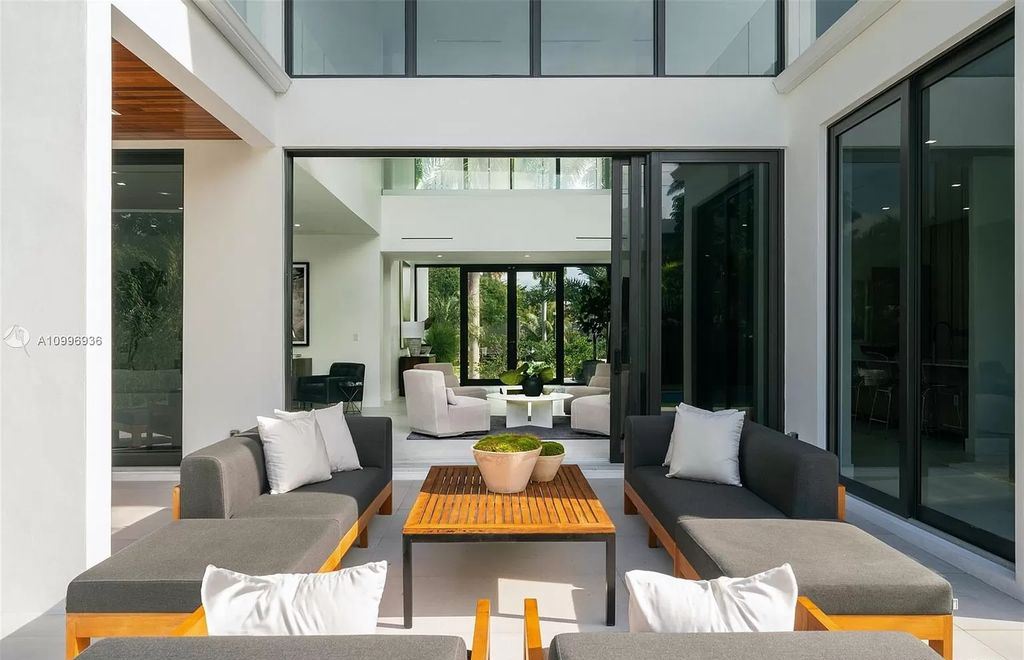 The Home in Miami Beach is a new construction modern oasis located on guard gated Hibiscus Island now available for sale. This home located at 112 W Palm Midway, Miami Beach, Florida; offering 5 bedrooms and 6 bathrooms with over 4,400 square feet of living spaces.