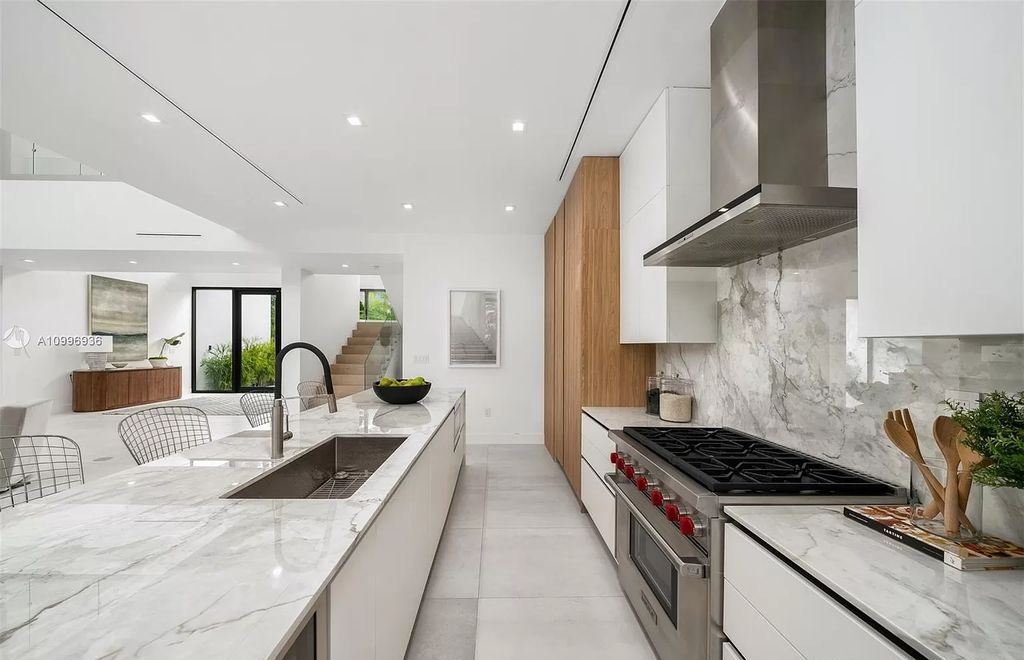 The Home in Miami Beach is a new construction modern oasis located on guard gated Hibiscus Island now available for sale. This home located at 112 W Palm Midway, Miami Beach, Florida; offering 5 bedrooms and 6 bathrooms with over 4,400 square feet of living spaces.