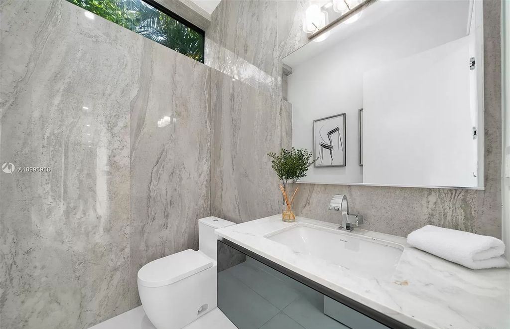 The Home in Miami Beach is a new construction modern oasis located on guard gated Hibiscus Island now available for sale. This home located at 112 W Palm Midway, Miami Beach, Florida; offering 5 bedrooms and 6 bathrooms with over 4,400 square feet of living spaces.