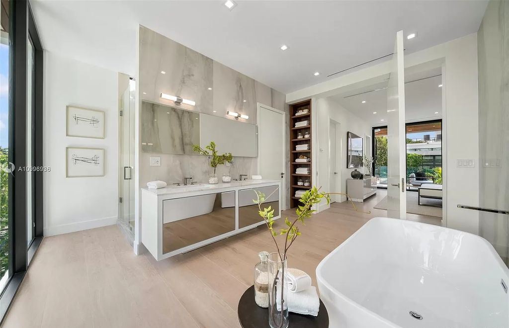 The Home in Miami Beach is a new construction modern oasis located on guard gated Hibiscus Island now available for sale. This home located at 112 W Palm Midway, Miami Beach, Florida; offering 5 bedrooms and 6 bathrooms with over 4,400 square feet of living spaces.