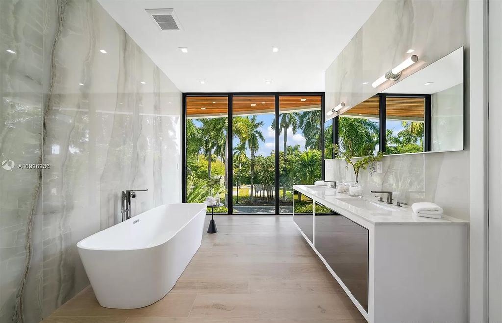 The Home in Miami Beach is a new construction modern oasis located on guard gated Hibiscus Island now available for sale. This home located at 112 W Palm Midway, Miami Beach, Florida; offering 5 bedrooms and 6 bathrooms with over 4,400 square feet of living spaces.
