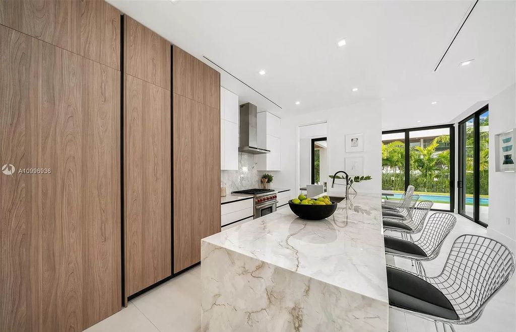 The Home in Miami Beach is a new construction modern oasis located on guard gated Hibiscus Island now available for sale. This home located at 112 W Palm Midway, Miami Beach, Florida; offering 5 bedrooms and 6 bathrooms with over 4,400 square feet of living spaces.