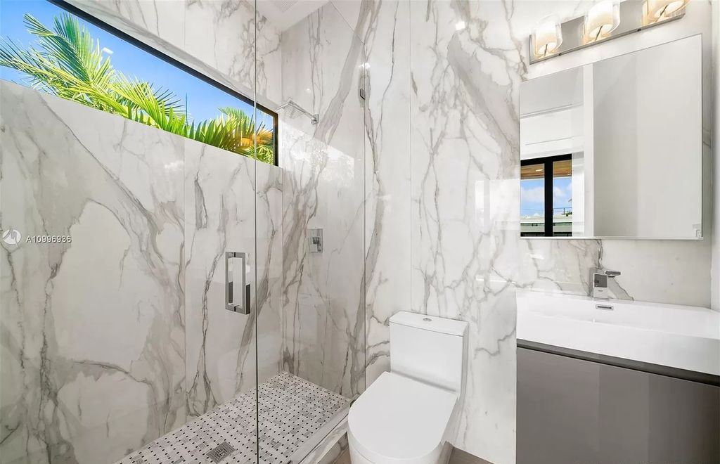 The Home in Miami Beach is a new construction modern oasis located on guard gated Hibiscus Island now available for sale. This home located at 112 W Palm Midway, Miami Beach, Florida; offering 5 bedrooms and 6 bathrooms with over 4,400 square feet of living spaces.