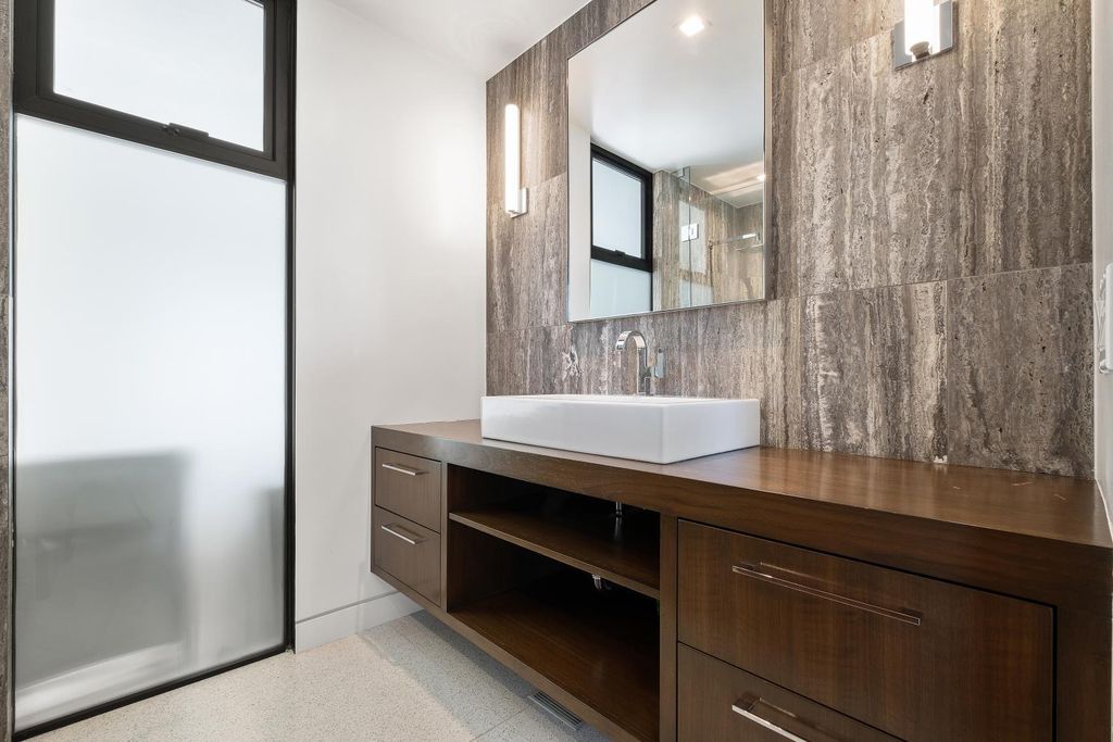 The Los Angeles Home is a Mid-Century Modern retreat boasts jetliner mountain and city views now available for sale. This home located at 8030 Mulholland Dr, Los Angeles, California; offering 3 bedrooms and 6 bathrooms with over 4,500 square feet of living spaces.