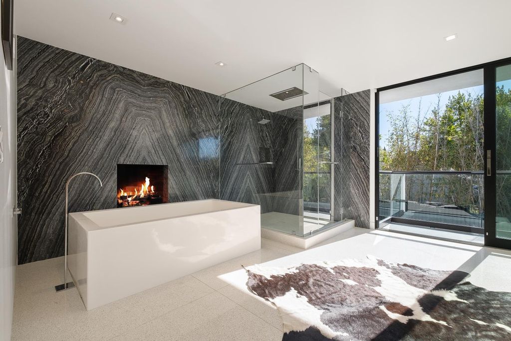 The Los Angeles Home is a Mid-Century Modern retreat boasts jetliner mountain and city views now available for sale. This home located at 8030 Mulholland Dr, Los Angeles, California; offering 3 bedrooms and 6 bathrooms with over 4,500 square feet of living spaces.