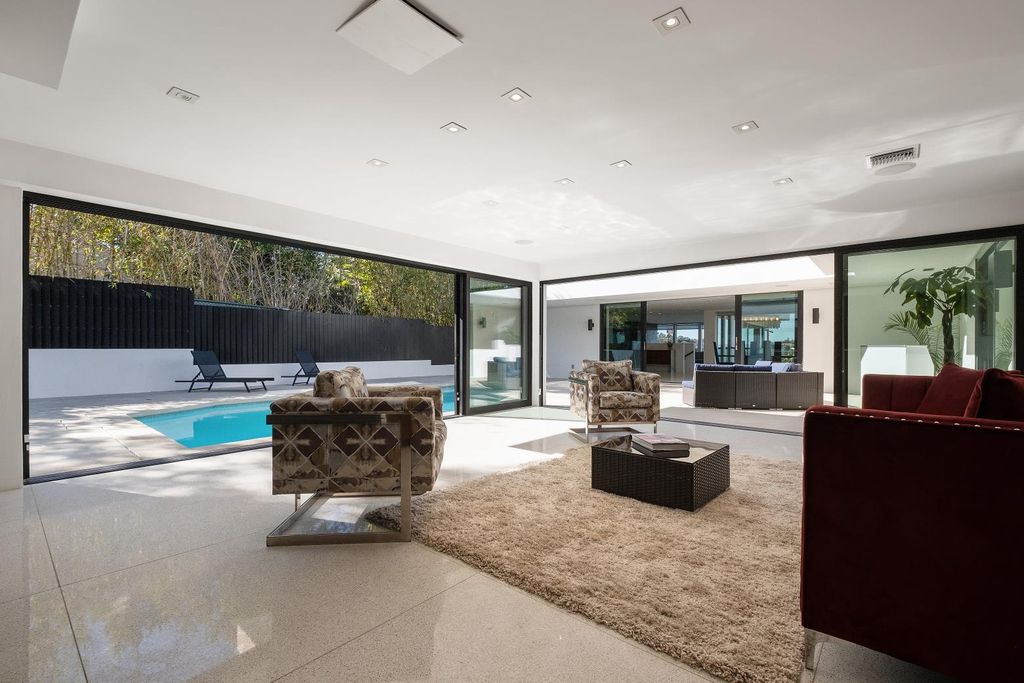 The Los Angeles Home is a Mid-Century Modern retreat boasts jetliner mountain and city views now available for sale. This home located at 8030 Mulholland Dr, Los Angeles, California; offering 3 bedrooms and 6 bathrooms with over 4,500 square feet of living spaces.