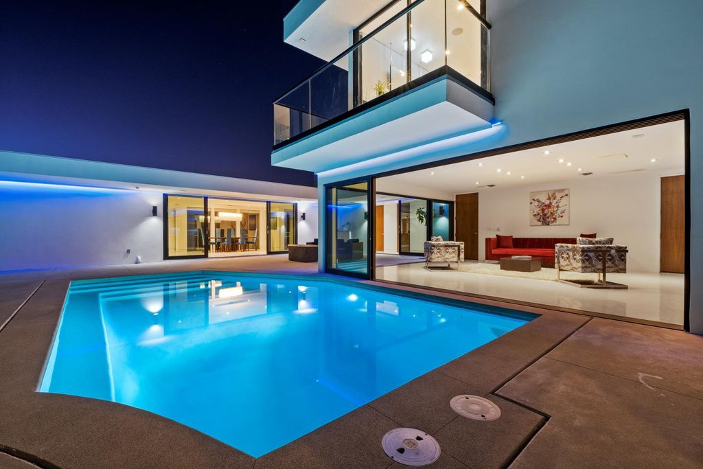 The Los Angeles Home is a Mid-Century Modern retreat boasts jetliner mountain and city views now available for sale. This home located at 8030 Mulholland Dr, Los Angeles, California; offering 3 bedrooms and 6 bathrooms with over 4,500 square feet of living spaces.