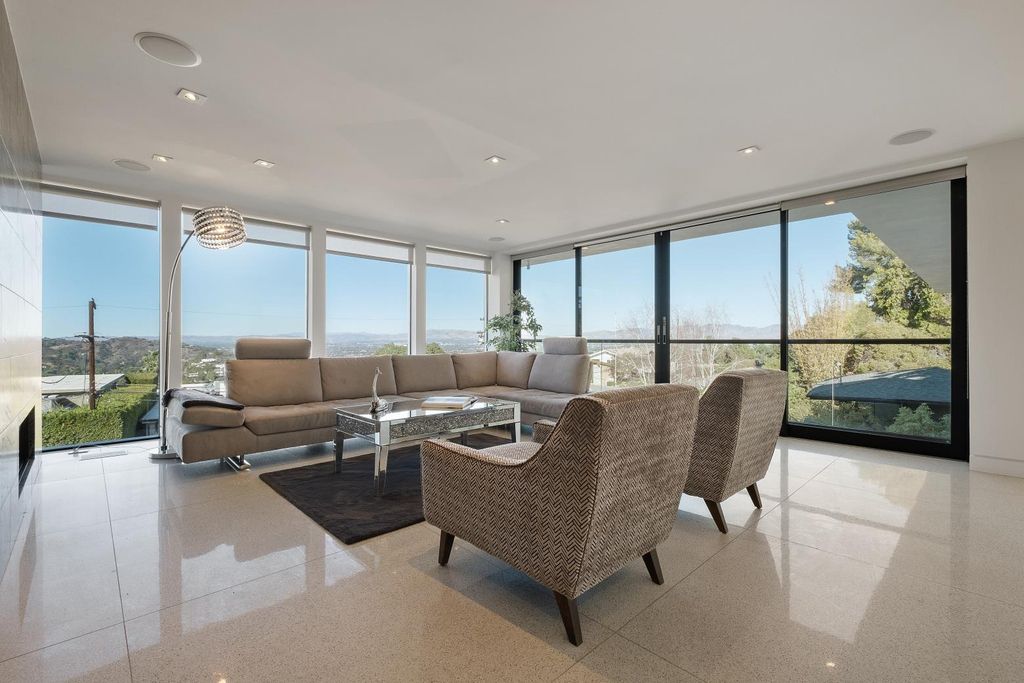 The Los Angeles Home is a Mid-Century Modern retreat boasts jetliner mountain and city views now available for sale. This home located at 8030 Mulholland Dr, Los Angeles, California; offering 3 bedrooms and 6 bathrooms with over 4,500 square feet of living spaces.