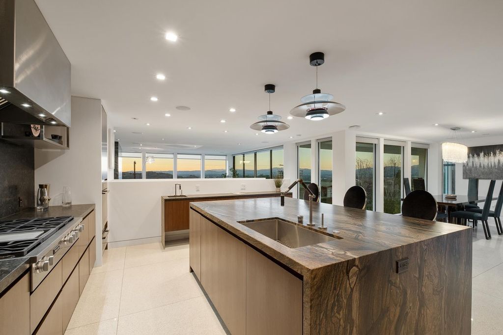 The Los Angeles Home is a Mid-Century Modern retreat boasts jetliner mountain and city views now available for sale. This home located at 8030 Mulholland Dr, Los Angeles, California; offering 3 bedrooms and 6 bathrooms with over 4,500 square feet of living spaces.