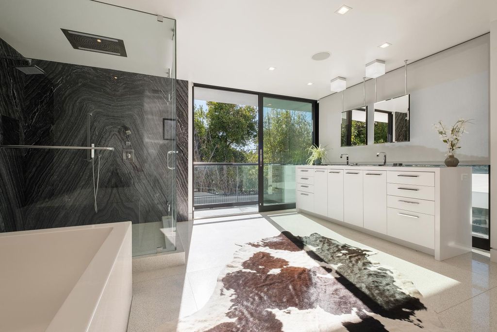 The Los Angeles Home is a Mid-Century Modern retreat boasts jetliner mountain and city views now available for sale. This home located at 8030 Mulholland Dr, Los Angeles, California; offering 3 bedrooms and 6 bathrooms with over 4,500 square feet of living spaces.