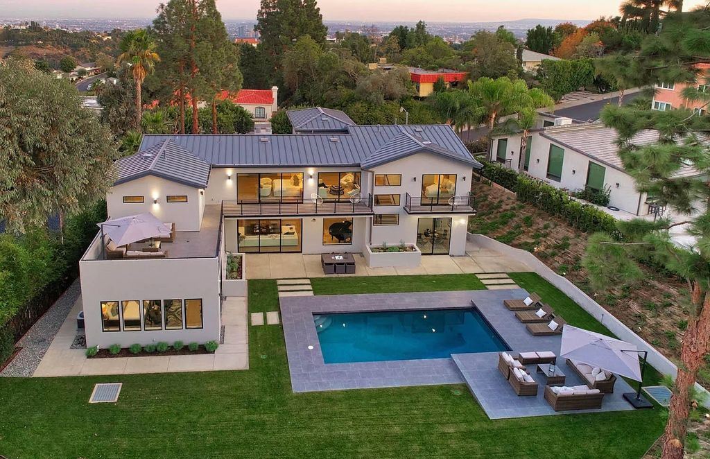 The Contemporary House is a modern masterpiece in prestigious Bel Air with elegant finishes boasts superb indoor, outdoor living now available for sale. This home located at 10825 Vicenza Way, Los Angeles, California; offering 5 bedrooms and 6 bathrooms with over 5,300 square feet of living spaces.
