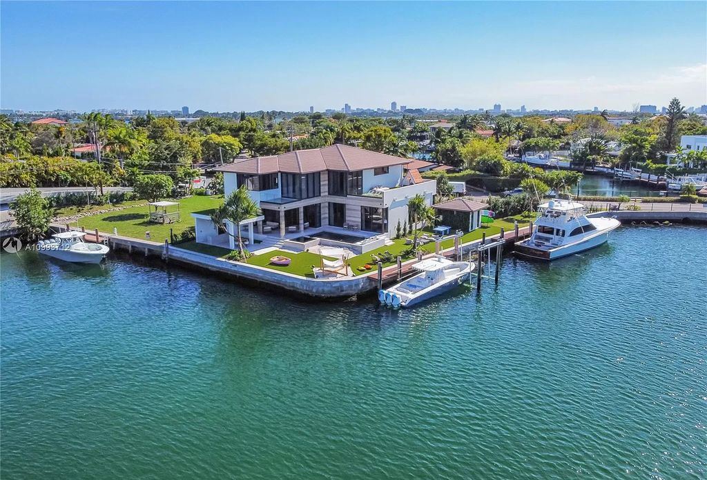 The Waterfront Home is a fully furnished smart residence with nice water views now available for sale. This home located at 2213 Keystone Blvd, North Miami, Florida; offering 5 bedrooms and 6 bathrooms with over 6,200 square feet of living spaces.