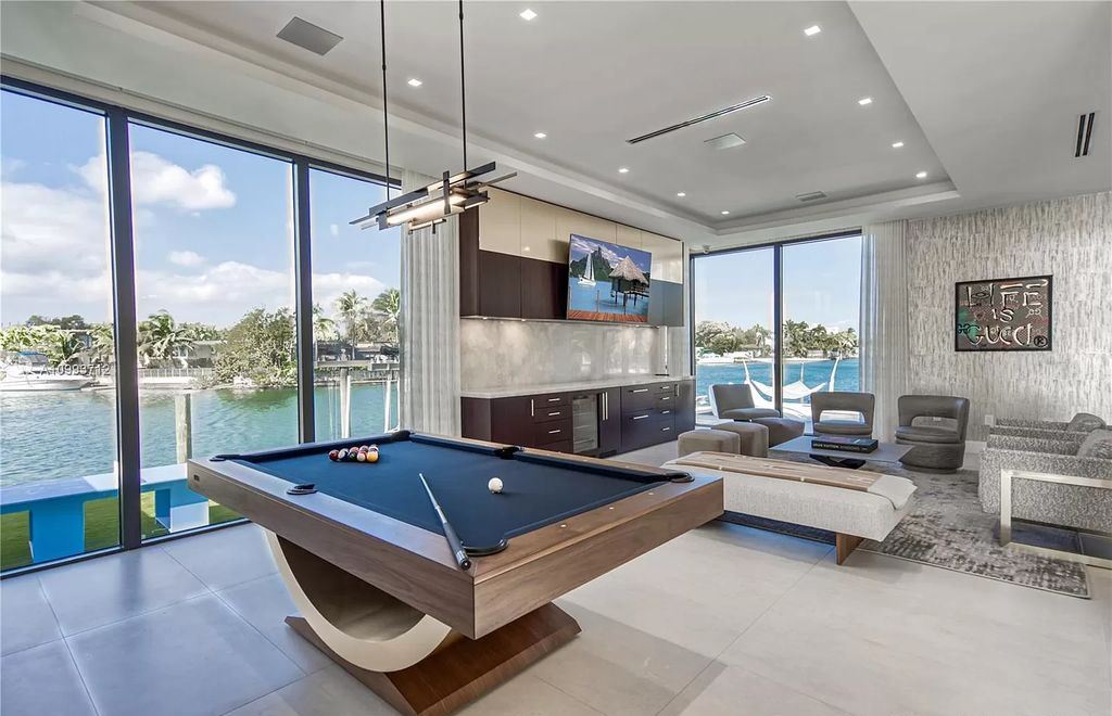 The Waterfront Home is a fully furnished smart residence with nice water views now available for sale. This home located at 2213 Keystone Blvd, North Miami, Florida; offering 5 bedrooms and 6 bathrooms with over 6,200 square feet of living spaces.