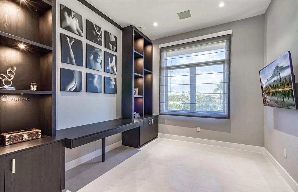 The Waterfront Home is a fully furnished smart residence with nice water views now available for sale. This home located at 2213 Keystone Blvd, North Miami, Florida; offering 5 bedrooms and 6 bathrooms with over 6,200 square feet of living spaces.