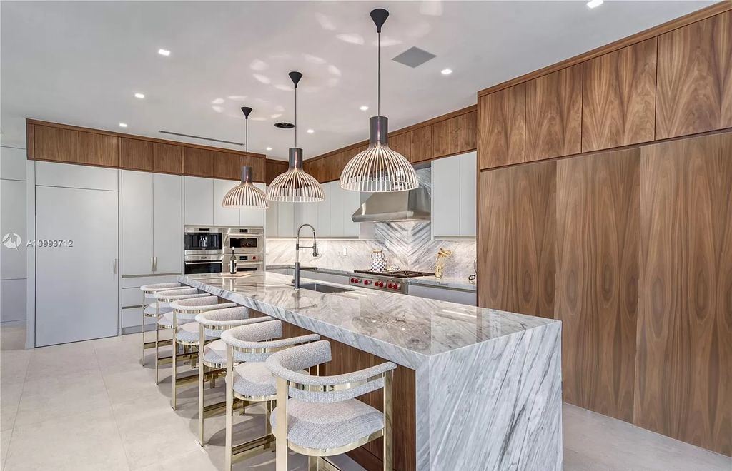The Waterfront Home is a fully furnished smart residence with nice water views now available for sale. This home located at 2213 Keystone Blvd, North Miami, Florida; offering 5 bedrooms and 6 bathrooms with over 6,200 square feet of living spaces.