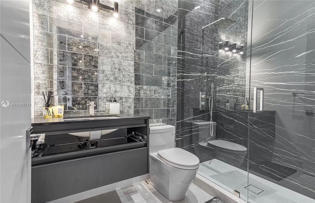 The Waterfront Home is a fully furnished smart residence with nice water views now available for sale. This home located at 2213 Keystone Blvd, North Miami, Florida; offering 5 bedrooms and 6 bathrooms with over 6,200 square feet of living spaces.
