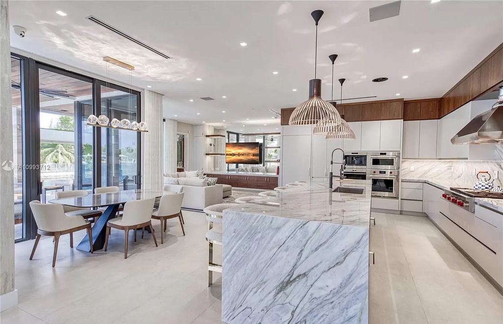 The Waterfront Home is a fully furnished smart residence with nice water views now available for sale. This home located at 2213 Keystone Blvd, North Miami, Florida; offering 5 bedrooms and 6 bathrooms with over 6,200 square feet of living spaces.